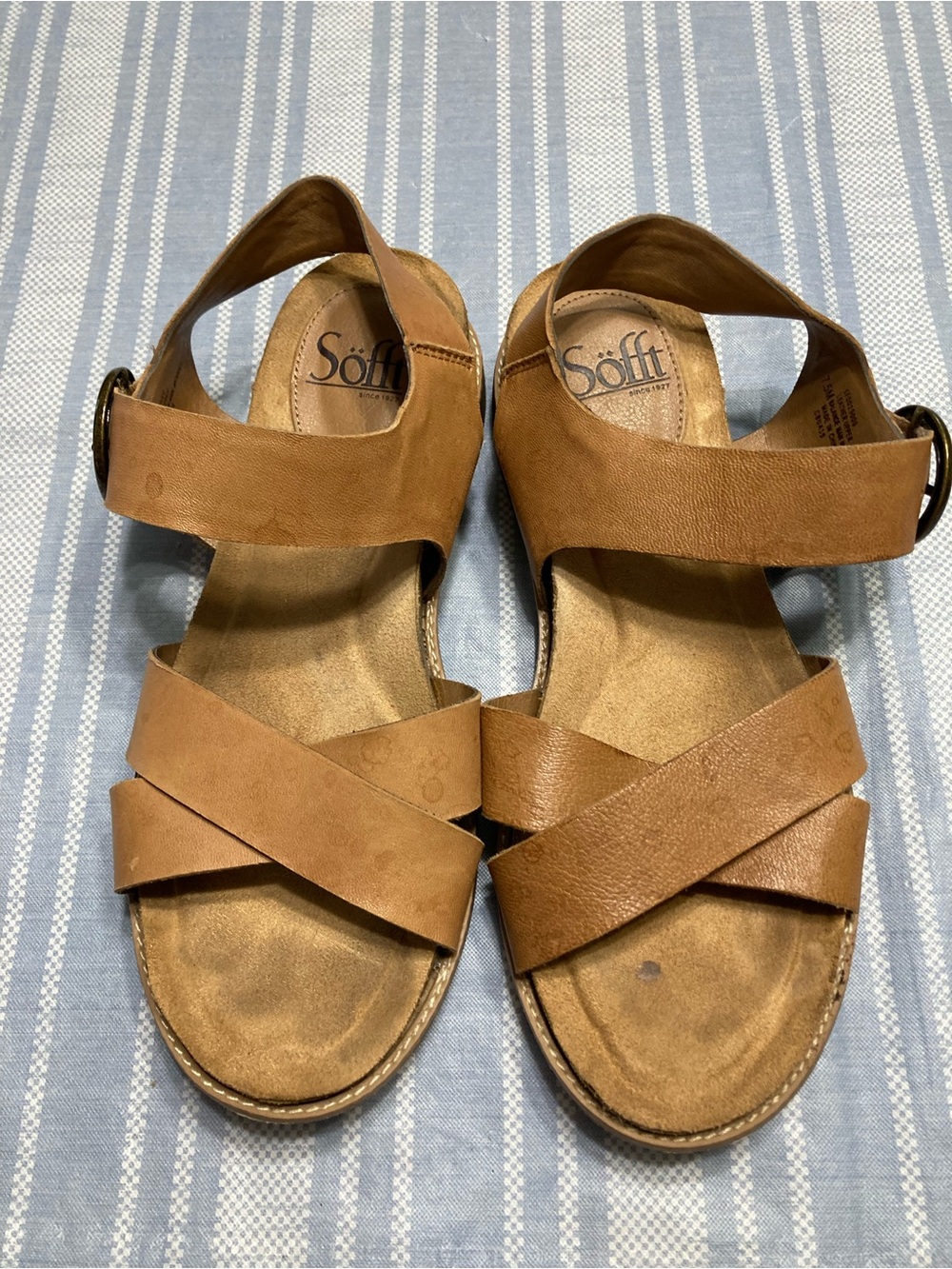 Sofft tan sandals with crisscross design.